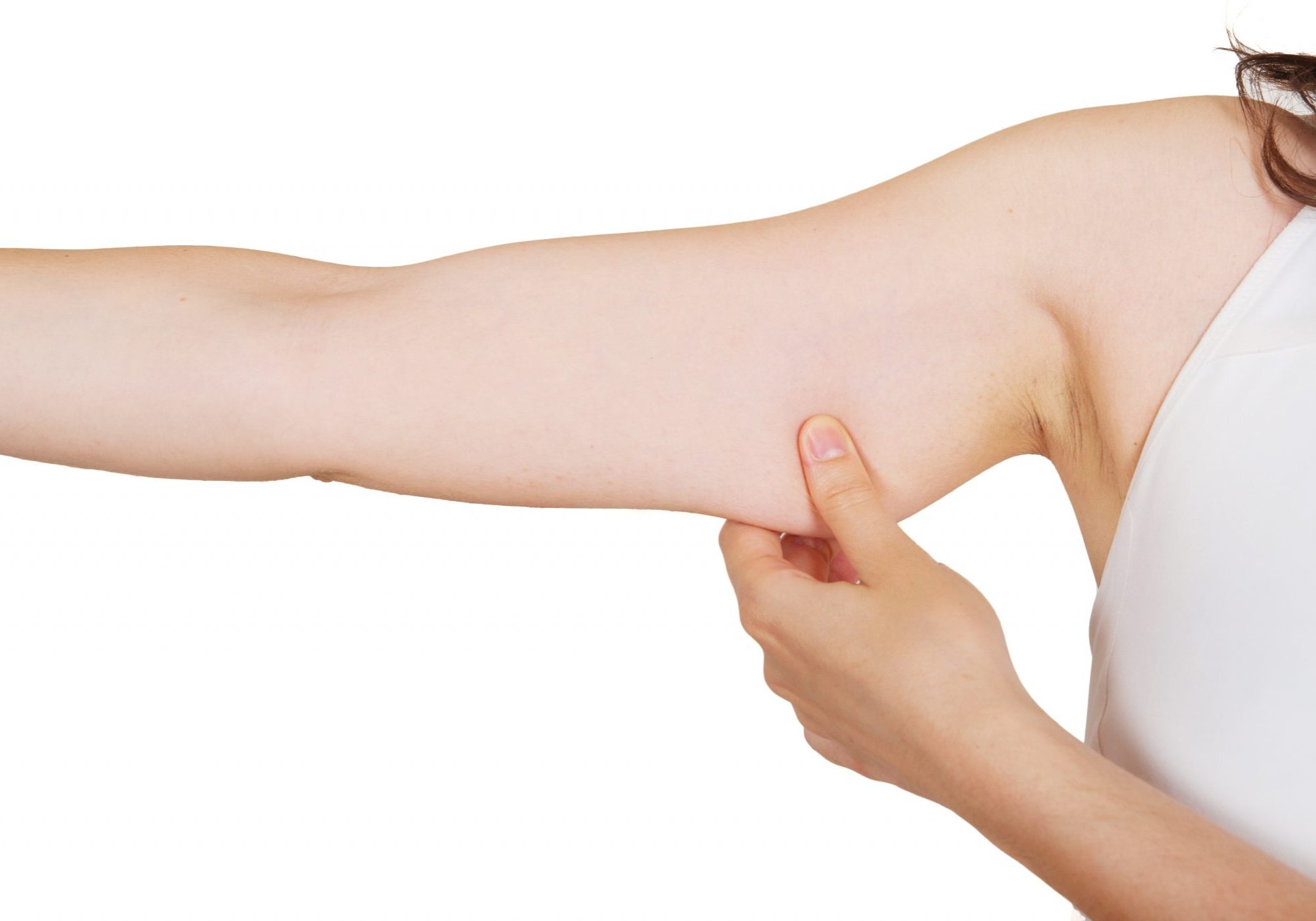 Young woman checking her arm fat