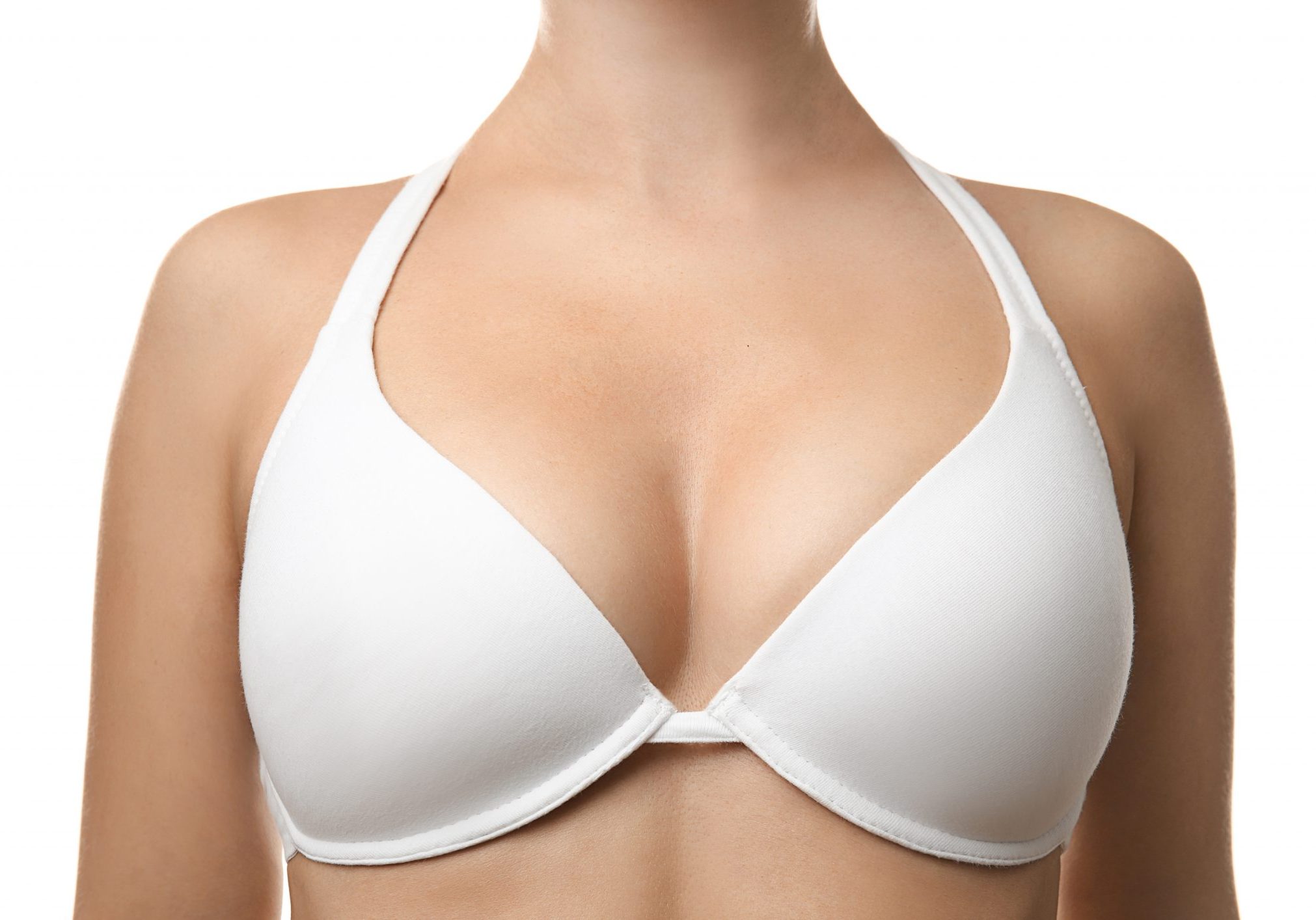 Plastic surgery concept. Woman in white bra, closeup